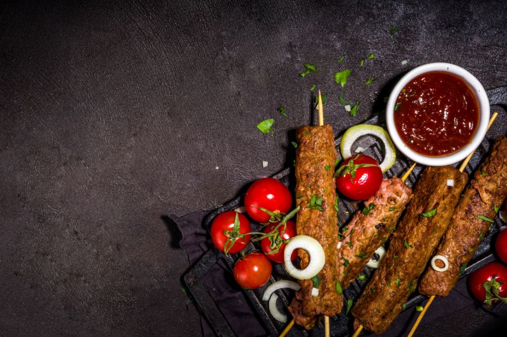 Adana Kebap - Spicy minced meat kebab on a skewer.